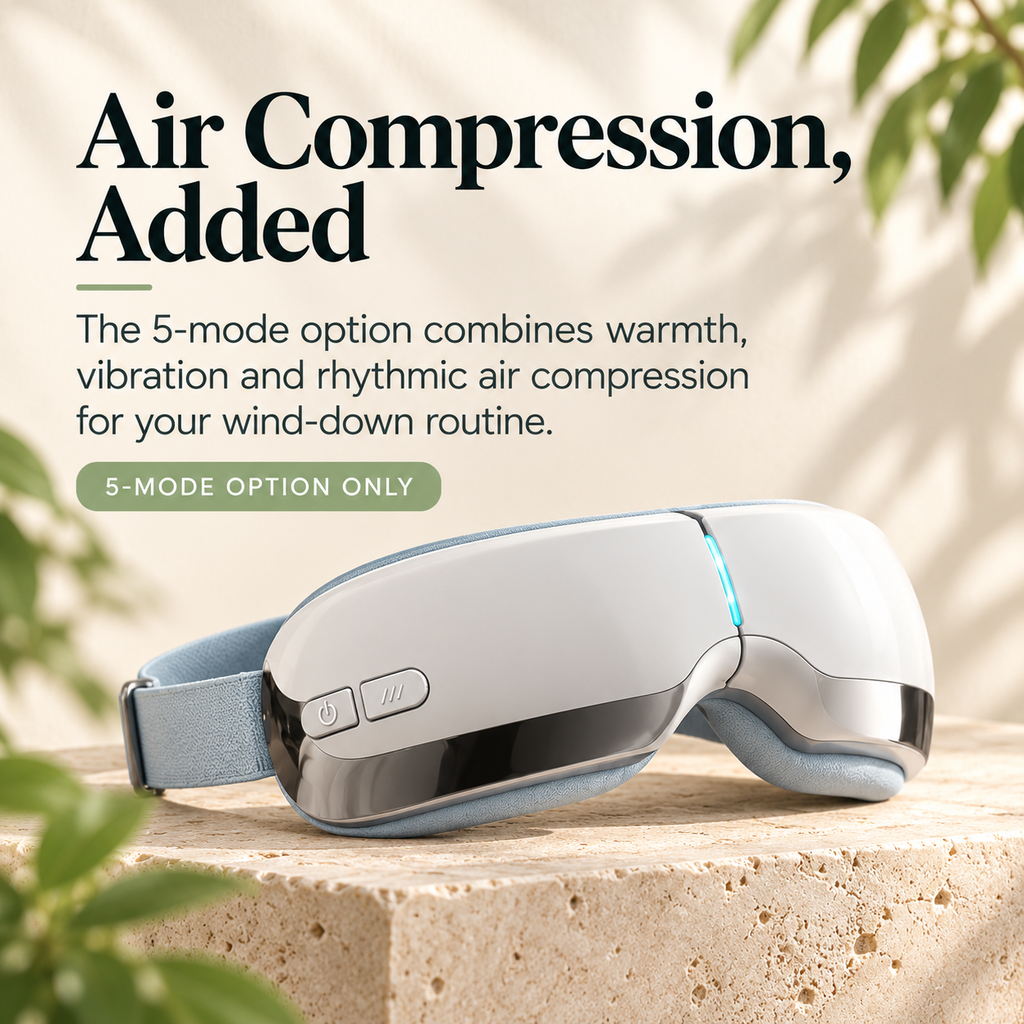 White ELM & ECHO 5-mode eye massager with a pale blue padded lining and adjustable strap on a stone display